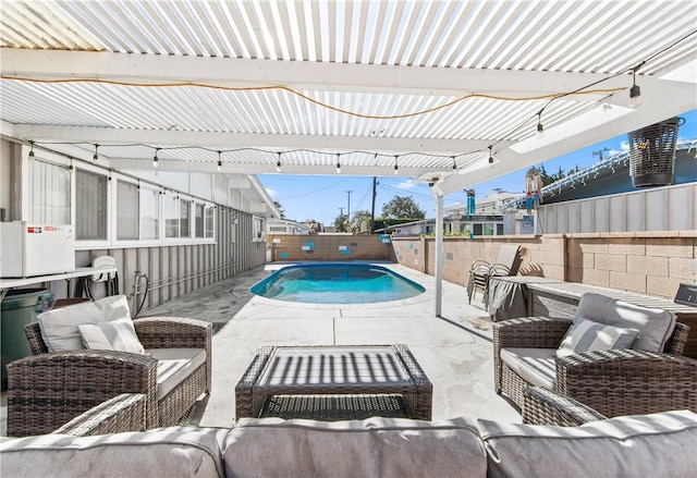 view of pool with an outdoor hangout area and a pergola