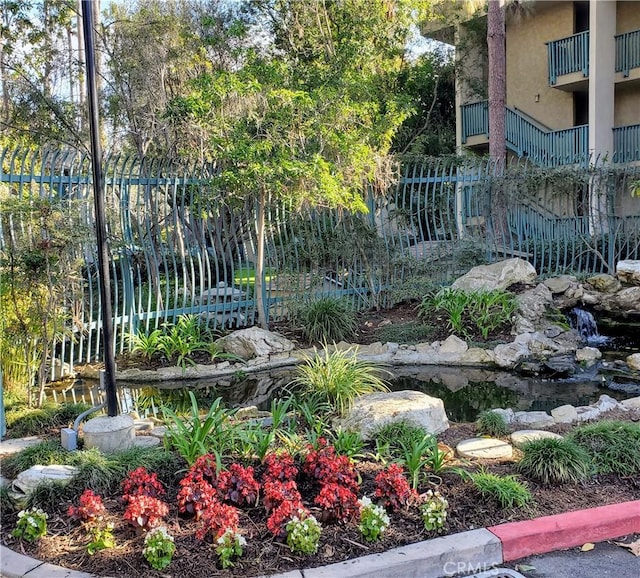 view of yard featuring a garden pond