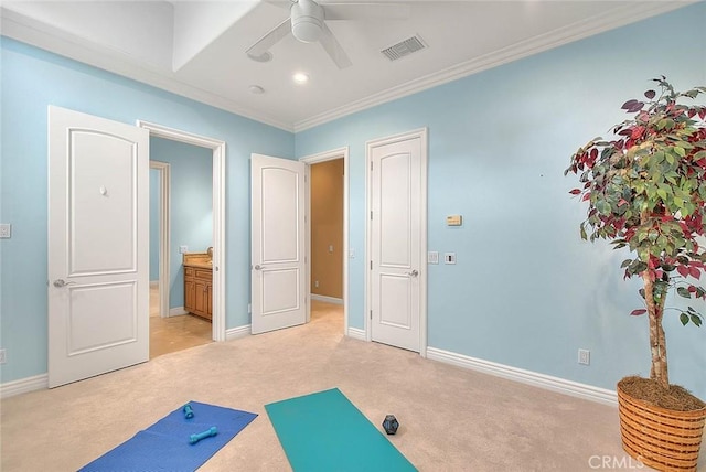 workout room featuring light carpet, crown molding, and ceiling fan