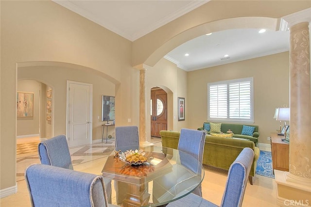 dining area featuring ornate columns and ornamental molding