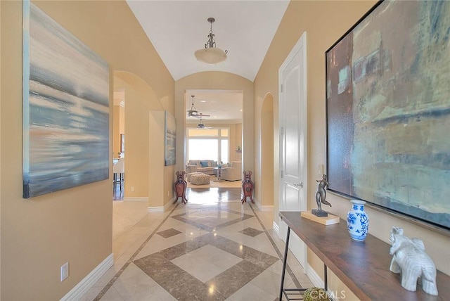 hallway featuring lofted ceiling