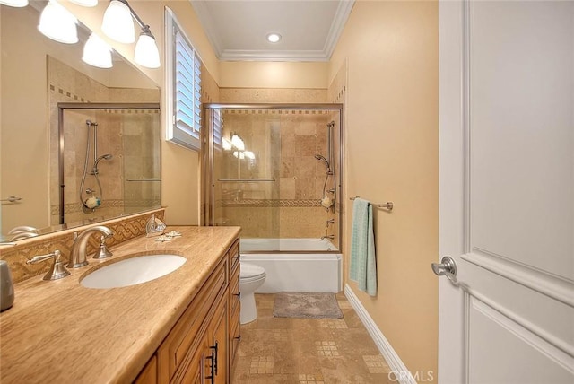 full bathroom with vanity, crown molding, shower / bath combination with glass door, and toilet