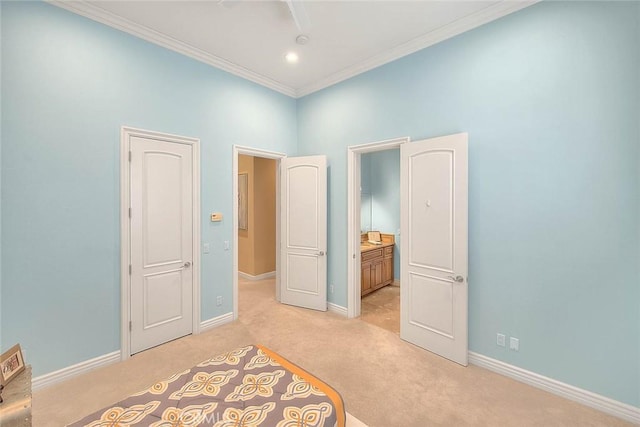 carpeted bedroom with crown molding, connected bathroom, and ceiling fan