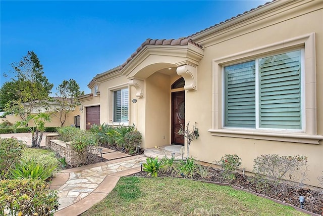 property entrance with a garage