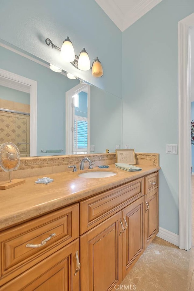 bathroom with tile patterned flooring, ornamental molding, a shower, and vanity