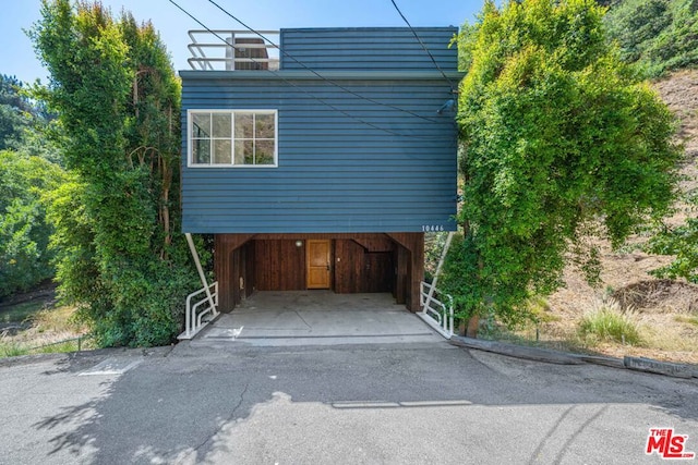 exterior space featuring a carport