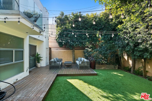 view of yard featuring an outdoor living space and a deck