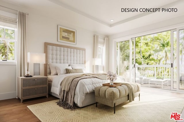 bedroom featuring hardwood / wood-style flooring and access to outside