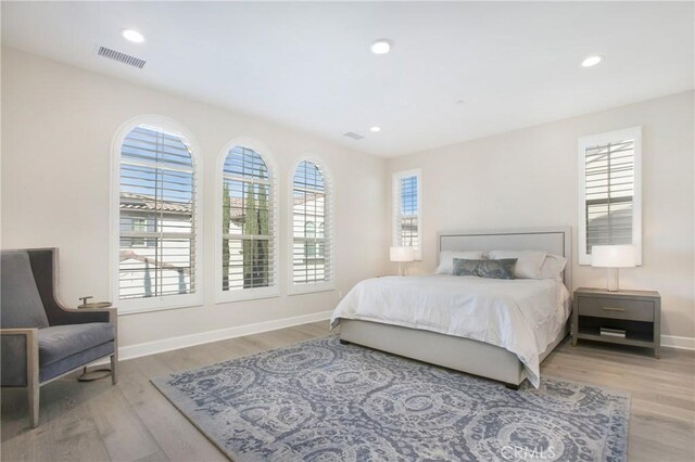 bedroom with light hardwood / wood-style flooring