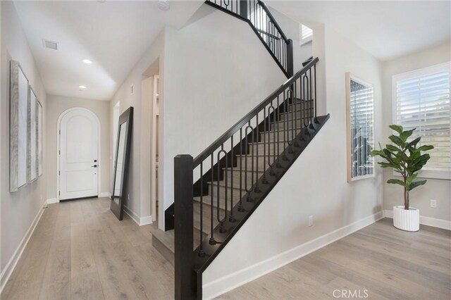 foyer with light hardwood / wood-style floors