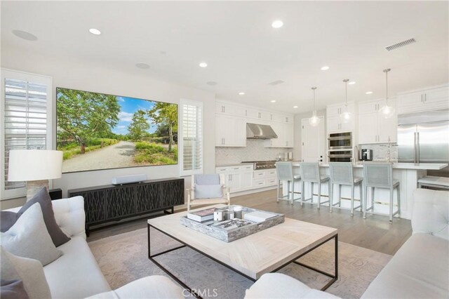 living room with light hardwood / wood-style flooring