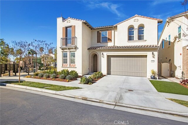 mediterranean / spanish-style home featuring a garage