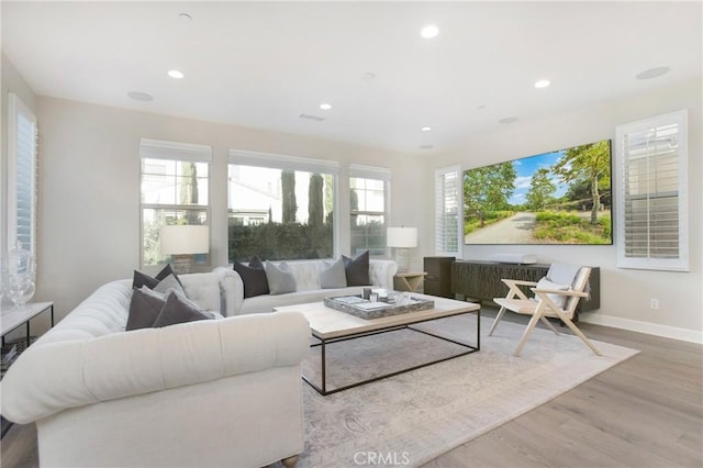 living room with light hardwood / wood-style floors