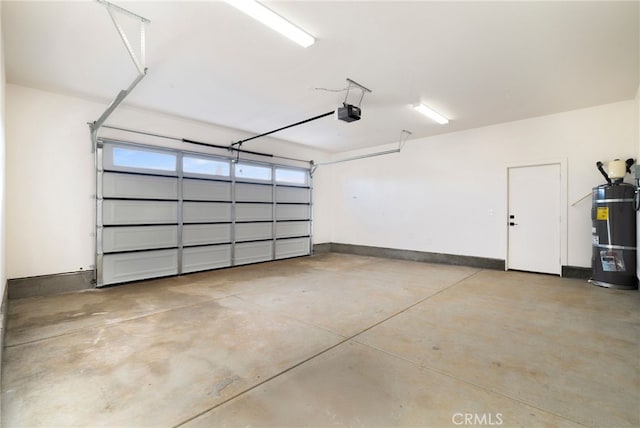 garage with strapped water heater and a garage door opener