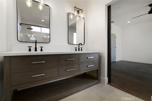 bathroom with vanity, a shower, and hardwood / wood-style flooring