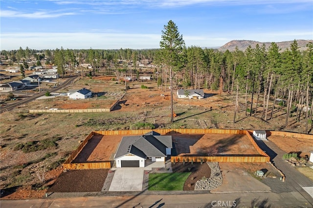 birds eye view of property with a mountain view