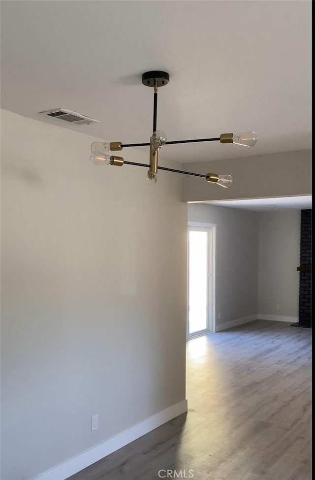 unfurnished room featuring wood-type flooring