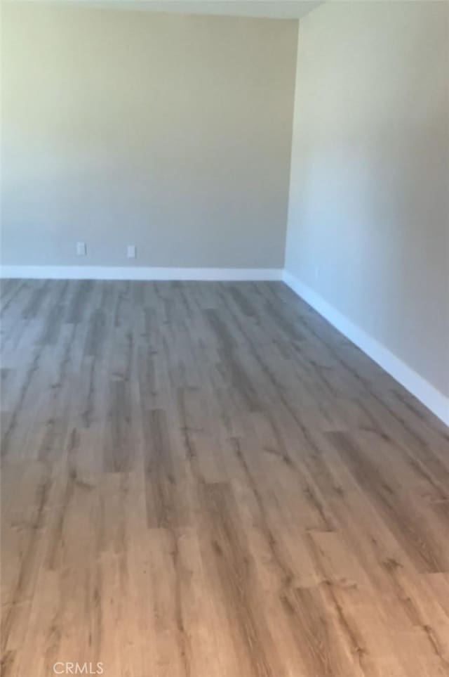 spare room featuring hardwood / wood-style floors