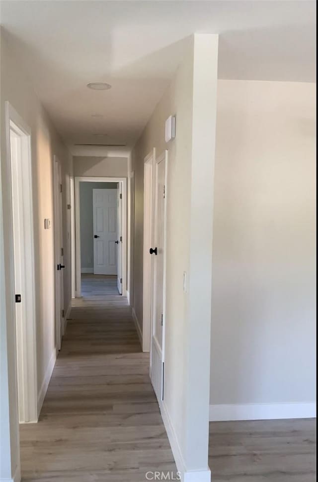 hallway featuring light wood-type flooring