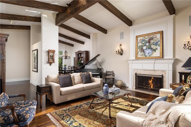 living room featuring dark hardwood / wood-style floors and vaulted ceiling with beams