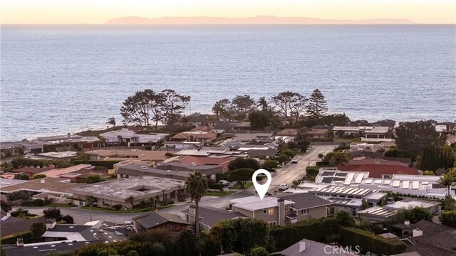 aerial view at dusk with a water view