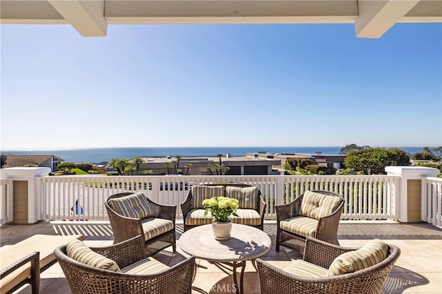 view of patio / terrace featuring a balcony and a water view