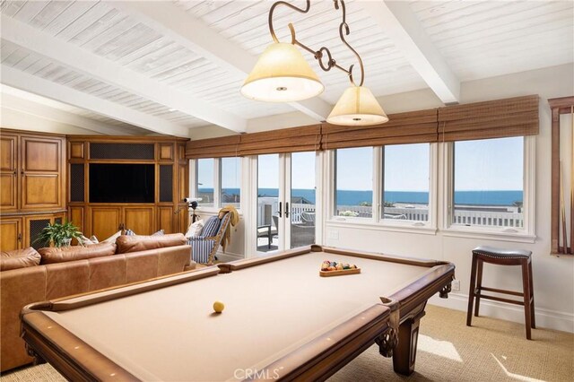 game room featuring a water view, billiards, vaulted ceiling with beams, and carpet flooring