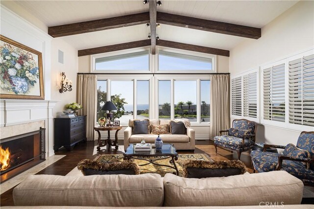 living room with dark wood-type flooring, a high end fireplace, and vaulted ceiling with beams