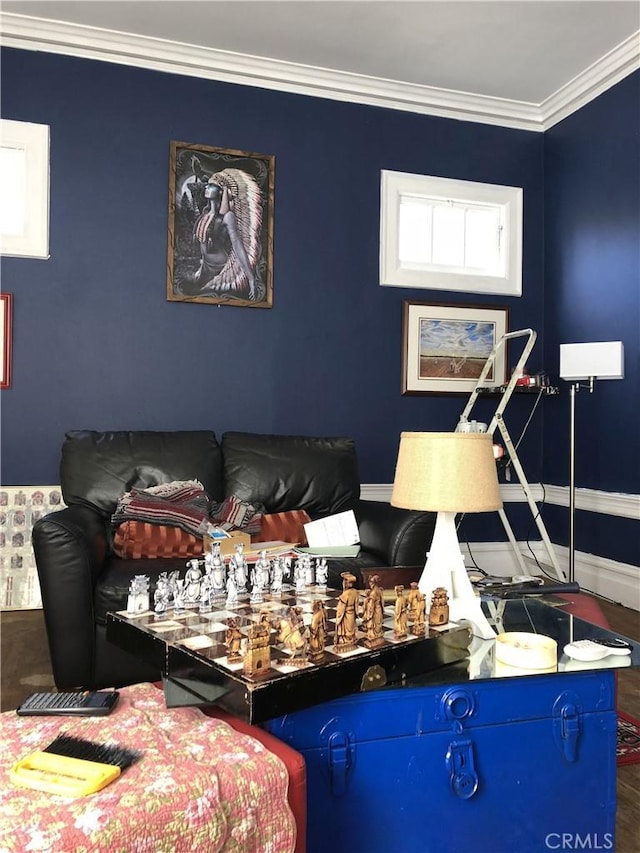 interior space with hardwood / wood-style flooring and ornamental molding