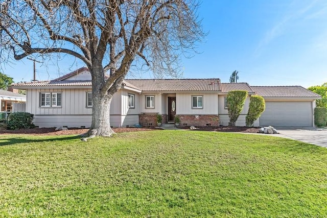 single story home with a front yard and a garage