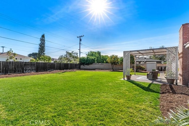 view of yard with a patio area and a pergola