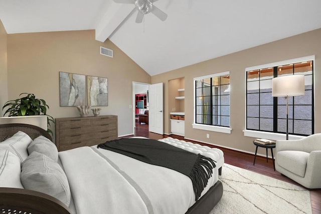 bedroom with ceiling fan, lofted ceiling with beams, wood-type flooring, and a walk in closet