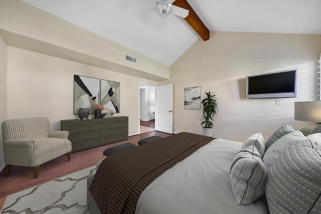 bedroom with ceiling fan, hardwood / wood-style floors, and vaulted ceiling with beams