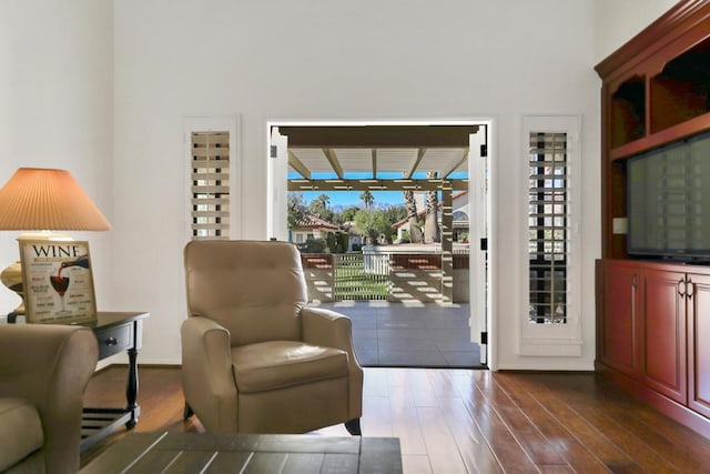 doorway with dark wood-type flooring