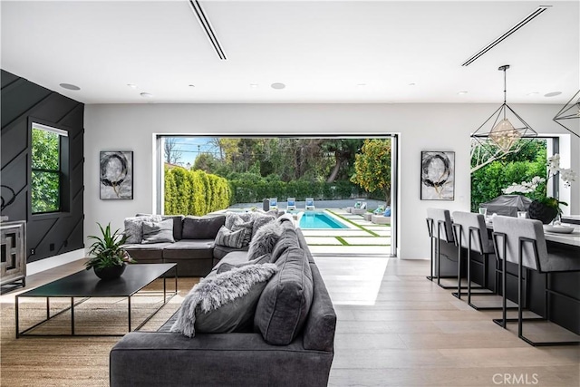 living room featuring light hardwood / wood-style floors and plenty of natural light