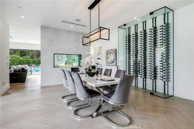 dining space featuring tile walls and light parquet floors