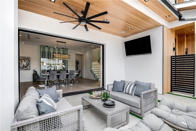 living room with wooden ceiling and ceiling fan