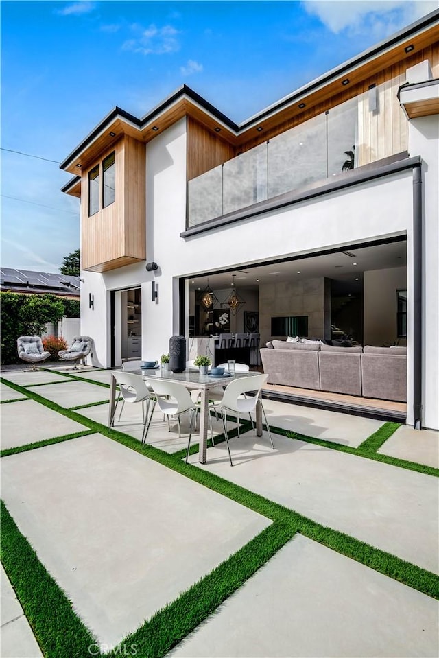 rear view of property with a patio area