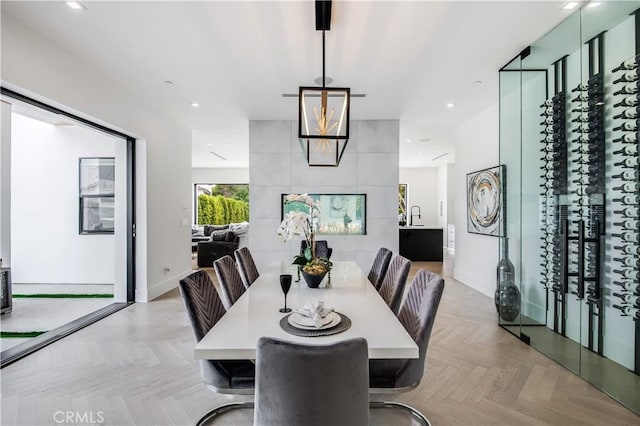 dining space with light parquet flooring