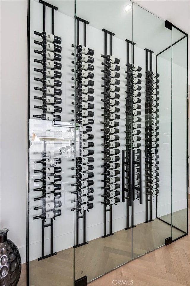 wine room with light parquet flooring