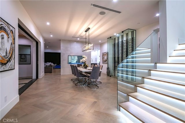 dining area featuring light parquet flooring