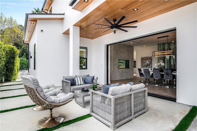 view of patio / terrace featuring ceiling fan and outdoor lounge area