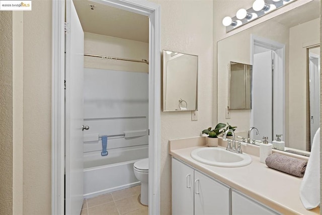 full bathroom with toilet, vanity, tile patterned flooring, and shower / bathtub combination