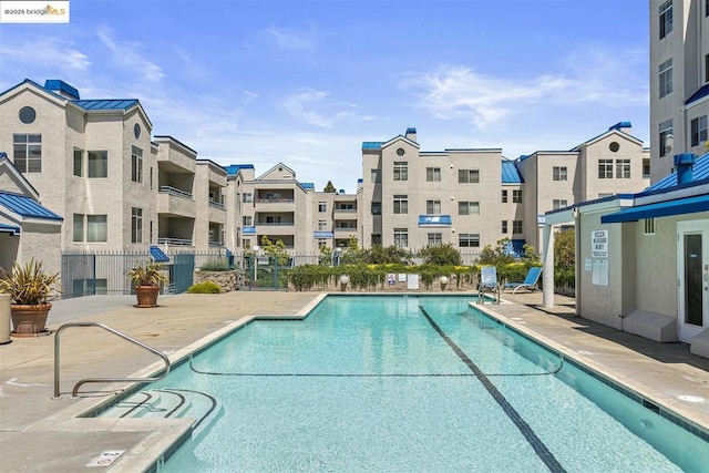 view of pool featuring a patio area