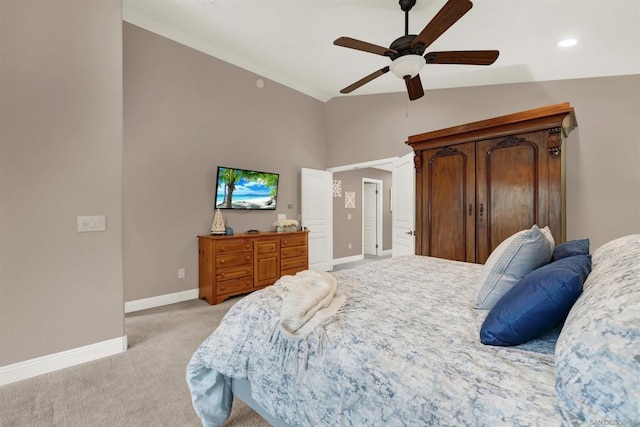 bedroom featuring ceiling fan, lofted ceiling, and light colored carpet