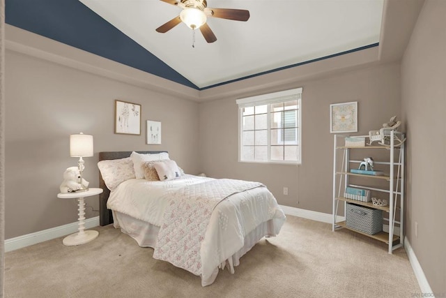 bedroom with ceiling fan, carpet, a raised ceiling, and lofted ceiling