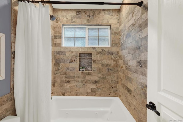 bathroom with shower / bath combo