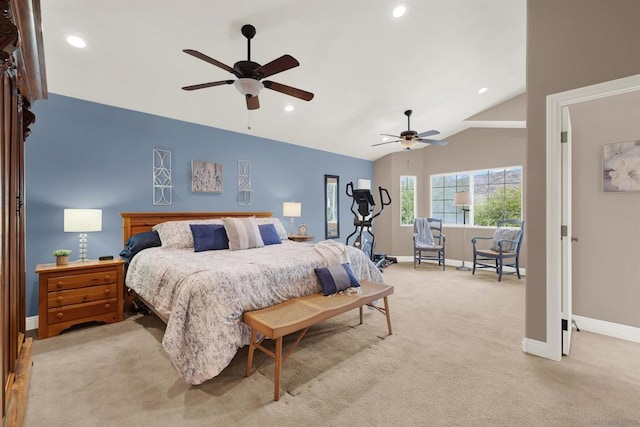 bedroom with ceiling fan, light colored carpet, and lofted ceiling