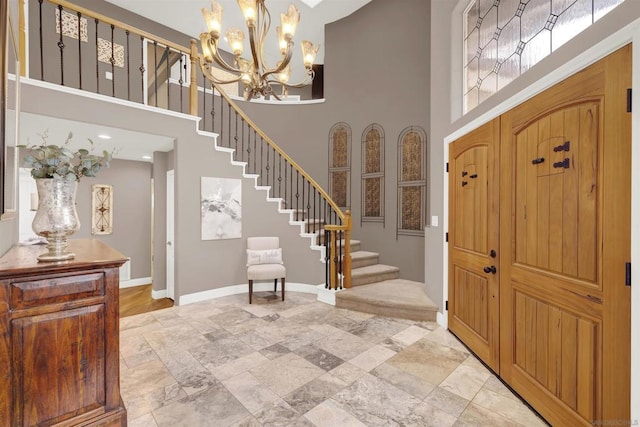 entryway featuring a high ceiling and a chandelier