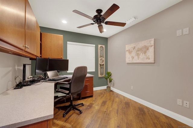 office space with ceiling fan and light hardwood / wood-style flooring